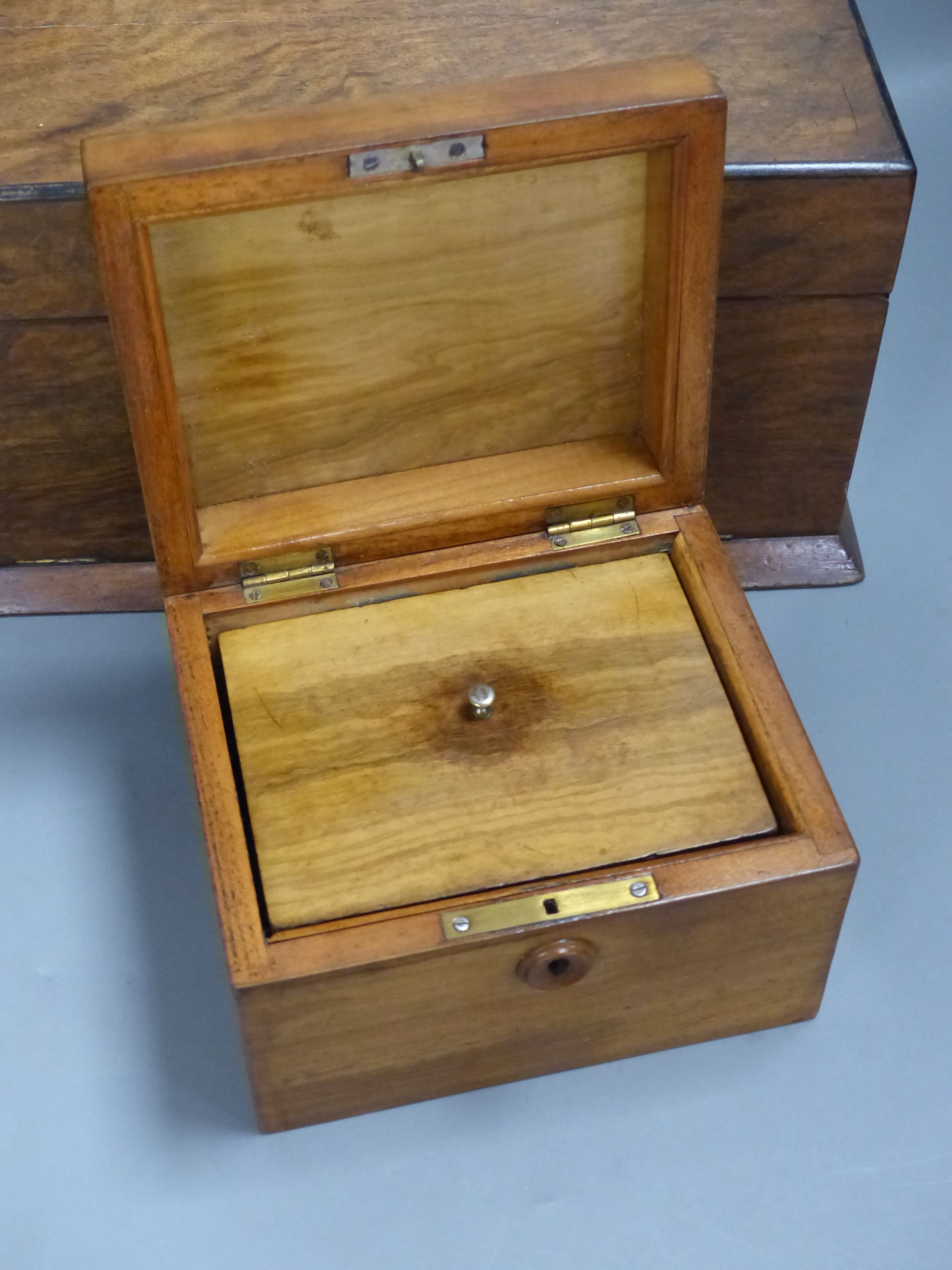 A Victorian walnut sewing box and two tea caddies (3)